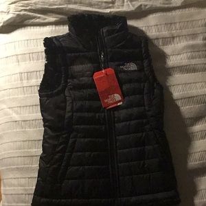 Girls black, reversible North Face vest